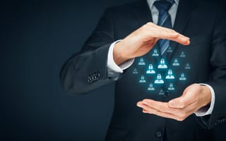 An image depicting a risk management executive with digital padlock icons hovering between their hands is shown.