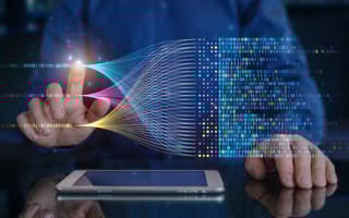 A hand hovers near a hologram of AI, representing data management.