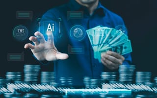 A hand reaches toward a digital illustration that says Ai while another hand holds a stack of cash to represent fintech.