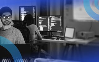 Two software developers work on terminals