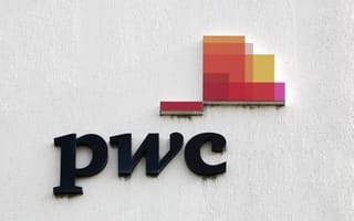 A close up of the PwC logo on the side of a building.