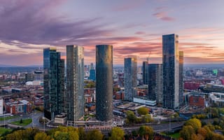 A photo of the Manchester skyline is shown.