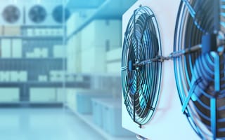 Cooling system fans in a brightly lit, modern industrial setting.