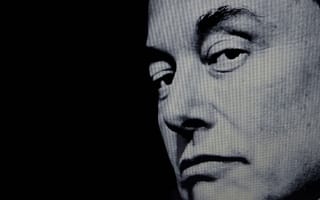 A black and white photo of tech mogul Elon Musk, who owns SpaceX, Tesla, Neuralink and other companies.