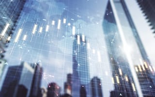 A skyline covered by a digital grid and line graph illustration is shown.