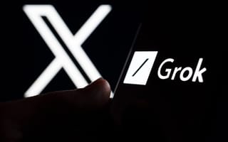 Grok on a smartphone in front of a screen with the xAI logo
