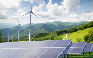 Solar energy panels and wind turbines are pictured.