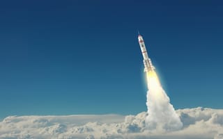 A rocket launches through the clouds into the upper atmosphere