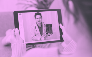 A patient uses her tablet to have a digital consultation with a doctor