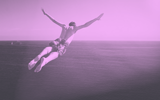 A purple-toned image of a man diving into the ocean. hybrid-creative-business-model