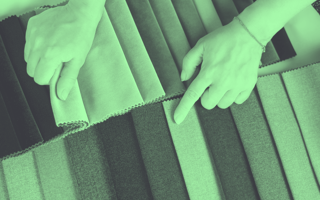 Data Fabric: What You Need to Know About the Next Big Thing A green-toned image of two hands selecting fabric samples. what-is-data-fabric