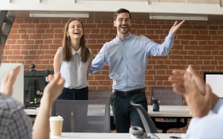 A woman is introduced to a new team of colleagues