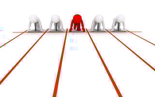 Five abstract person shapes wearing ties in ready position at the starting line, looking toward the reader. The center person is red, while the two to the left and right of them are white.