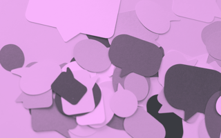 A purple-toned image of speech bubbles cut out of multicolored construction paper. /corporate-innovation/minimum-viable-sentence