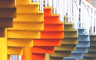 Multi-colored stairways offering different paths and perspectives to the top.