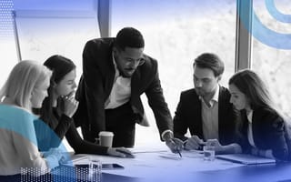 A manager leads a team meeting