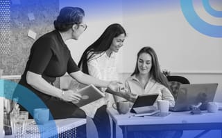 Three women collaborate over a tablet. /data-science/mentors-needed-career-industry-development