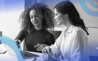 sales-pipeline-review two women look at a computer screen together