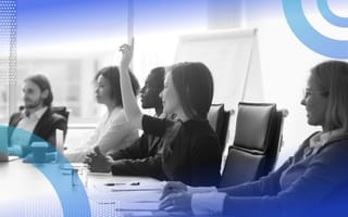 An image of a woman raising her hand in a meeting. /employee-engagement/employees-needs-for-engagement