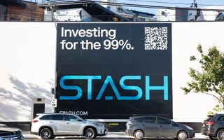 A Stash billboard that says "investing for the 99%"