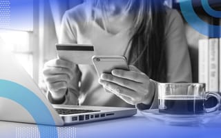 deep learning e-commerce woman holding phone and credit card sitting in front of laptop with cup of coffee