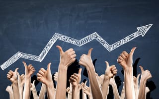 Hands reaching up giving a thumbs-up to a rising graph line with an upward arrow.