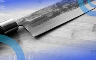 A knife rests on a wooden cutting board. /design-ux/design-sharpest-competitive-edge