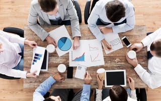 Birdseye view of six people working around table