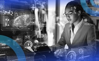 A woman works at a computer with a big data overlay