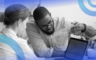 l2-regularization people discussing a topic in front of a laptop