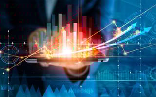 Businessman using tablet analyzing sales data and economic growth graph chart