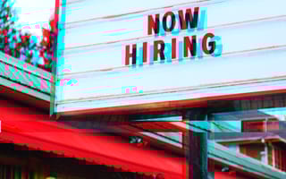 A large billboard marketing a nearby company's recruitment efforts.