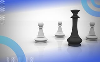 A black queen chess piece stands in front of three white pawn chess pieces. /career-development/when-how-develop-influence