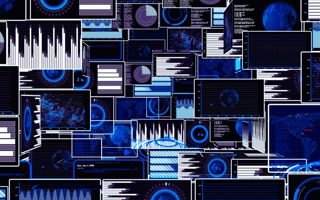 An array of monitors used by a computer systems analyst to monitor a computer systems status.