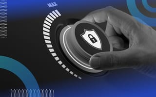 A hand turns a dial with a security symbol on it toward max level. /cybersecurity/risks-during-growth-stage