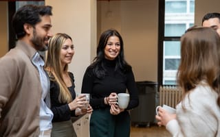 Reonomy coworkers chatting and having coffee