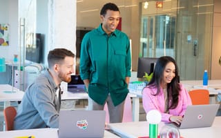 Wix coworkers having a team huddle