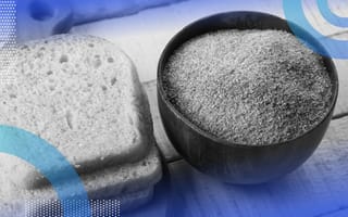 Several slices of bread next to a bowl of breadcrumbs