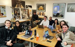 Instapage team gathers around a conference table