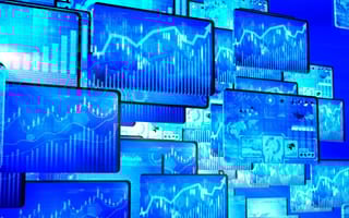 A collage of monitors displaying different data visualization formats.