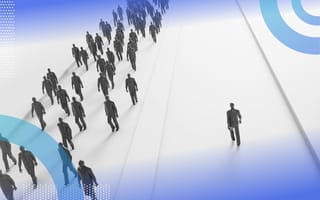 A group of people walks down one path while a single person chooses a second path