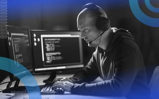 A hacker works at a computer terminal