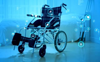 A wheelchair with health icons around it representing the health factors monitored by remote health devices.