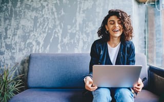 A woman connects with co-workers over a video chat.