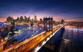 New York City at sunset from the Brooklyn Bridge.