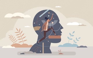 person walking up steps in front of silhouette of another person's head