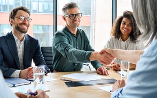 business people shaking hands at a meeting