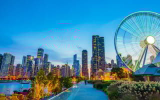 View of Navy Pier at dusk with Chicago skyline in the background