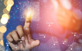 close up of a persons hand pressing a button with an electronic circuit