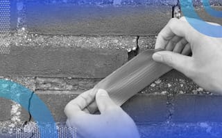 A person applies duct tape over a crack in masonry. /customer-success/customer-success-not-making-customers-happy